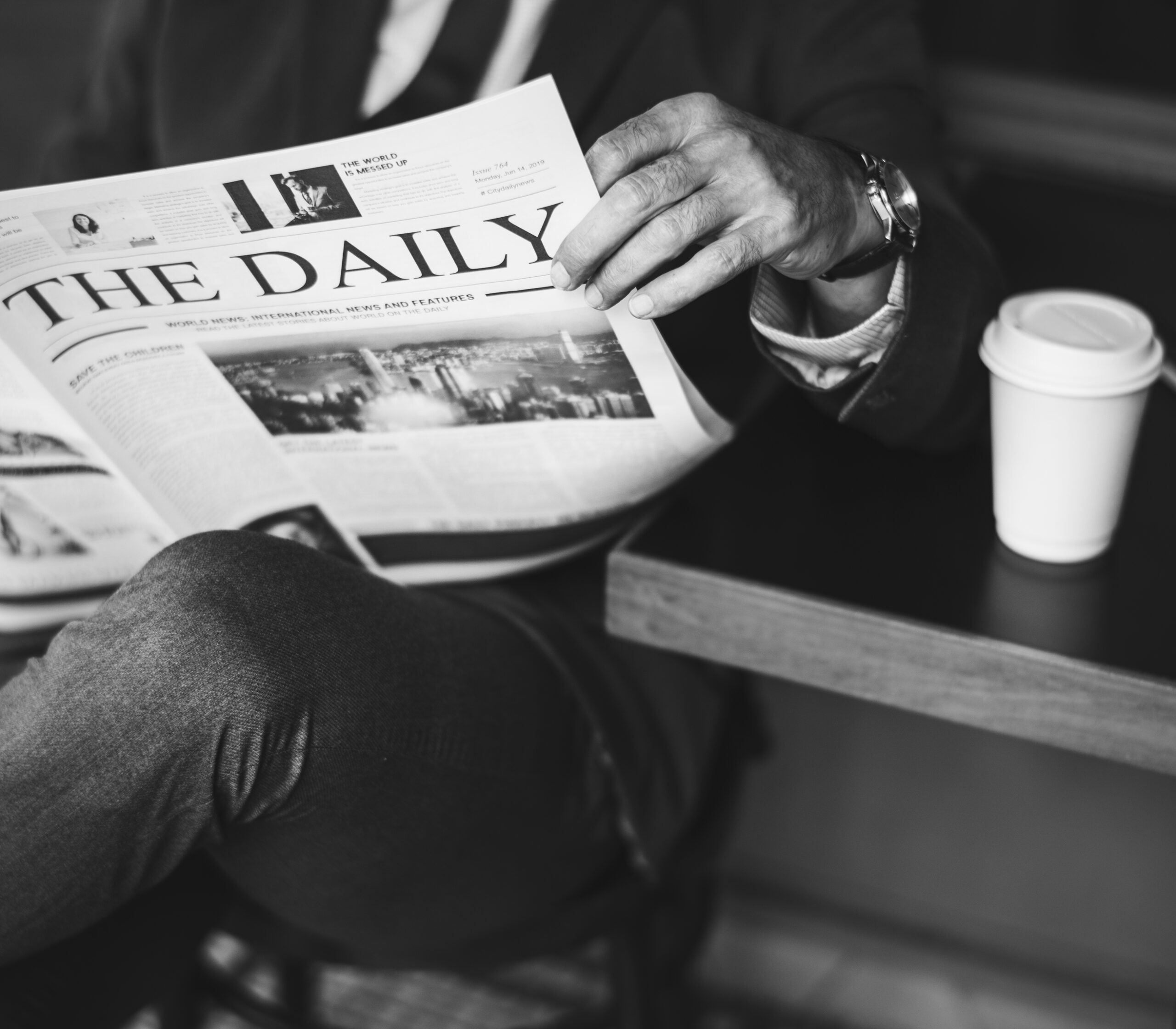 Businessman Reading Daily News Scaled